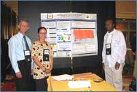 Image of Project Nexus members at confernce poster session.
